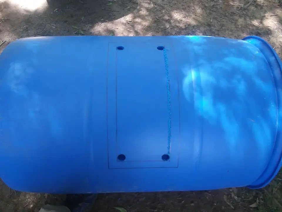 drilling holes in aquaponics barrel